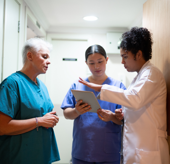 healthcare workers grouped with ipad