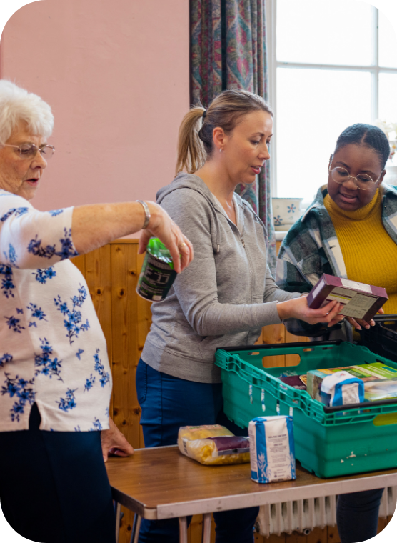 Volunteers packing food donations
