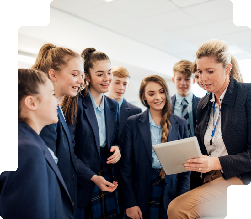 students looking at a teachers ipad in a science lesson