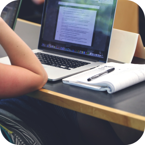 a laptop on a school desk during class