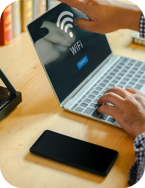 man connecting to wifi on a laptop byod device