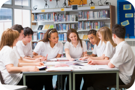 school children studying in library